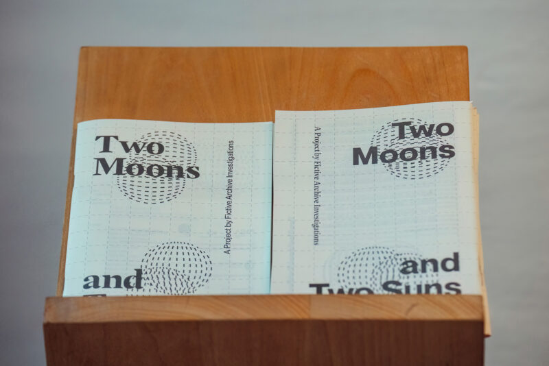 Two Moons and Two Suns Exhibition 2point3 Graphic Design